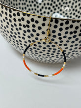 Load image into Gallery viewer, Orange/Blk Beaded Hoops
