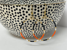 Load image into Gallery viewer, Orange/Blk Beaded Hoops
